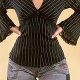 Blusa vintage con rayas y encaje en contraste