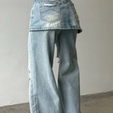 Vaqueros de tiro alto, asimétricos y de pierna ancha en denim lavado