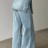 Vaqueros de tiro alto, asimétricos y de pierna ancha en denim lavado