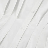 Blusa blanca plisada con cintura ajustada