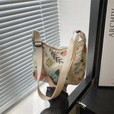 Bolso bandolera de tela con estampado invernal en forma de media luna