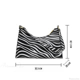 Bolso de hombro de piel sintética con estampado de cebra