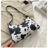 Bolso de hombro de piel sintética con estampado de cebra
